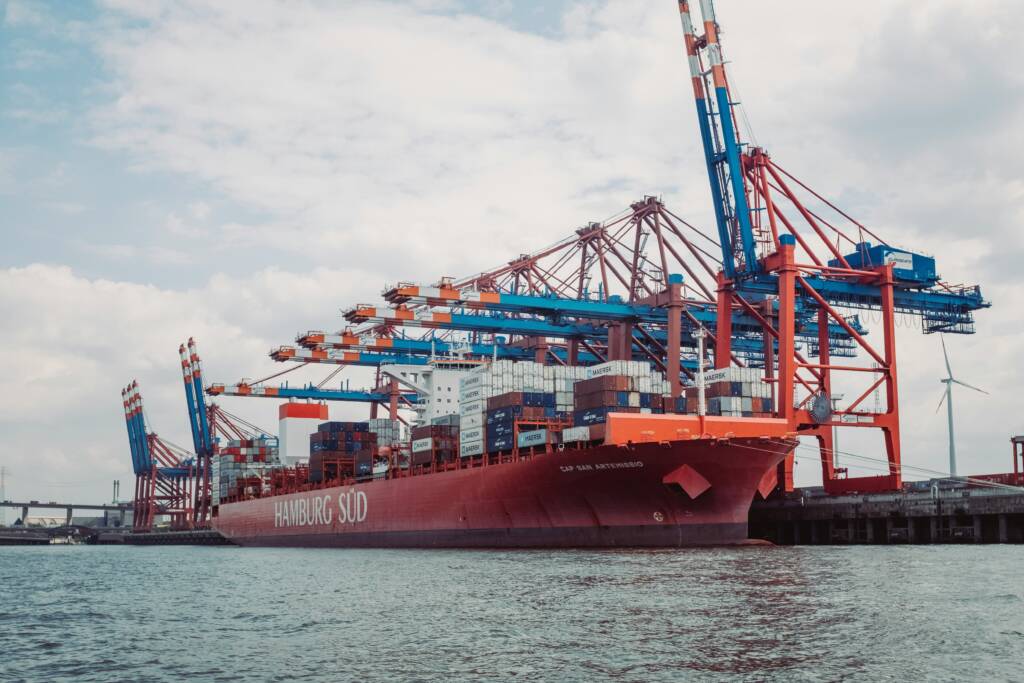 Cargo ship at berth illustrating shore power for ships as an alternative to onboard auxiliary generators